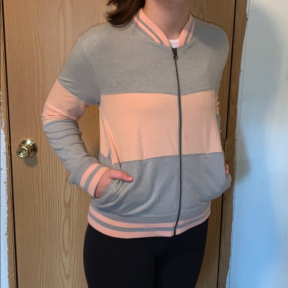 Woman’s “ABOUND” sweatshirt.